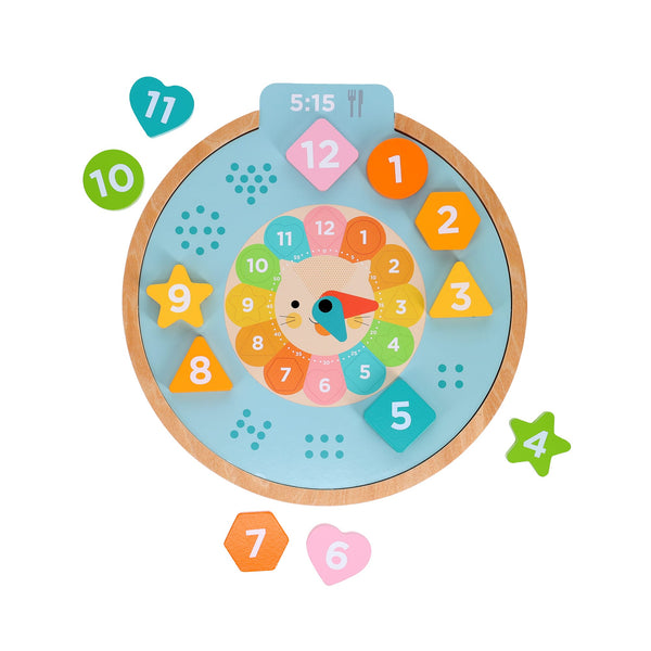 The Petit Collage Multi-Language + Counting + Colors Wooden Learning Clock is a colorful toy with removable numbered shapes and a vibrant clock face, designed to teach time, colors, and counting.
