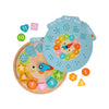 The Petit Collage Multi-Language + Counting + Colors Wooden Learning Clock features numbered shapes, movable clock hands, and blue activity cards to help children learn to tell time.