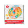 The Petit Collage Multi-Language + Counting + Colors Wooden Learning Clock helps children learn to tell time, count, and recognize colors and shapes in several languages.