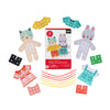 The Petit Collage Petit Friends Dress-Up Lacing Set includes cardboard cat and rabbit figures, colorful paper clothing with holes, laces, and packaging labeled for ages 4+, perfect for creative dress-up fun.