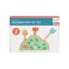 The Petit Collage Petit Friends Wooden Pop-Up Toy features three woodland animals on a green hill and is recommended for ages 12 months and up.