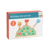 Box of Petit Collage Petit Friends Wooden Pop-Up Toy with three woodland animal figures on a polka dot background, suitable for ages 12 months and up.