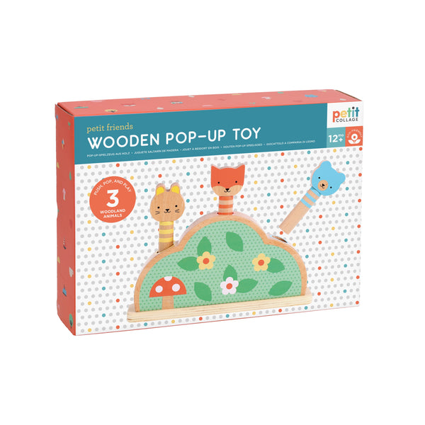 Box of Petit Collage Petit Friends Wooden Pop-Up Toy with three woodland animal figures on a polka dot background, suitable for ages 12 months and up.