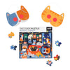 Petit Collage’s Catventures - The Sleepover: 100-Piece Decoder Puzzle is a children’s cat-themed set that includes a box, two cat face masks, and puzzle pieces arranged around the box.