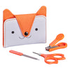 The Petit Collage Baby Manicure Kit includes a fox-themed pouch with a button, orange-handled scissors, a nail clipper, and a nail file.