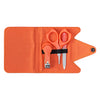 The Petit Collage Baby Manicure Kit features nail clippers, scissors, a metal nail file, and a cuticle pusher in an orange case with elastic band, displayed on a white background.