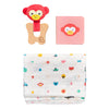 The Petit Collage Little Monkey Baby Gift Set includes a red monkey rattle, a pink board book with a monkey face, and a colorful patterned muslin cloth.