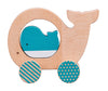 The Petit Collage Wooden Push Along Whale Toy features a whale-shaped wooden design with two decorated wheels and a small blue whale figure inside.
