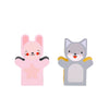 The Petit Collage Petit Friends Puppet Theatre Set features two smiling cartoon animal hand puppets—a pink bunny with a star on its belly and a gray cat with a white belly—both facing forward against a white background.