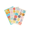 Three sheets from the Petit Collage Petit Friends Puppet Theatre Set with colorful stickers of various shapes, patterns, and cartoon faces arranged in rows.