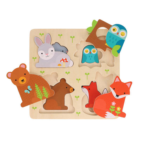 The Reveal Puzzle: You Are My Baby by Petit Collage features wooden pieces shaped like a rabbit, owl, bear, and fox, shown partially removed from their matching slots on the puzzle board.
