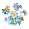 The Petit Collage Telling the Time 25-Piece Floor Puzzle features cartoon animals and a central clock, with five large puzzle pieces arranged around it.