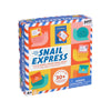 The colorful Petit Collage Snail Express box shows illustrated snails, letters, and a postbox. It’s a mail race game for ages 4+, includes 30+ stickers, and features a small parts warning on the packaging.