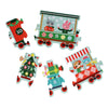 The Petit Collage Christmas Train Shaped Floor Puzzle features five vibrant pieces, each with cartoon animals, festive decorations, and the numbers 4, 5, 7, 9, and 10 forming a holiday train.