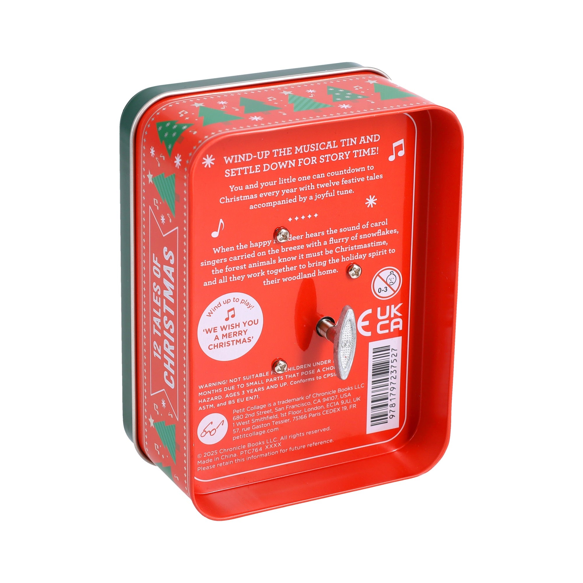The Petit Collage 12 Tales of Christmas tin features a red and green Christmas design, a wind-up music mechanism inside the lid, and festive instructions for enjoying a musical story time.