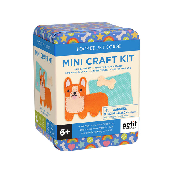 The Mini Craft Kit: Pocket Pet Corgi by Petit Collage comes in a colorful box with images of a felt corgi, bone, and dog bowl. Decorated with bones, hearts, and rainbows. Suitable for ages 6+.