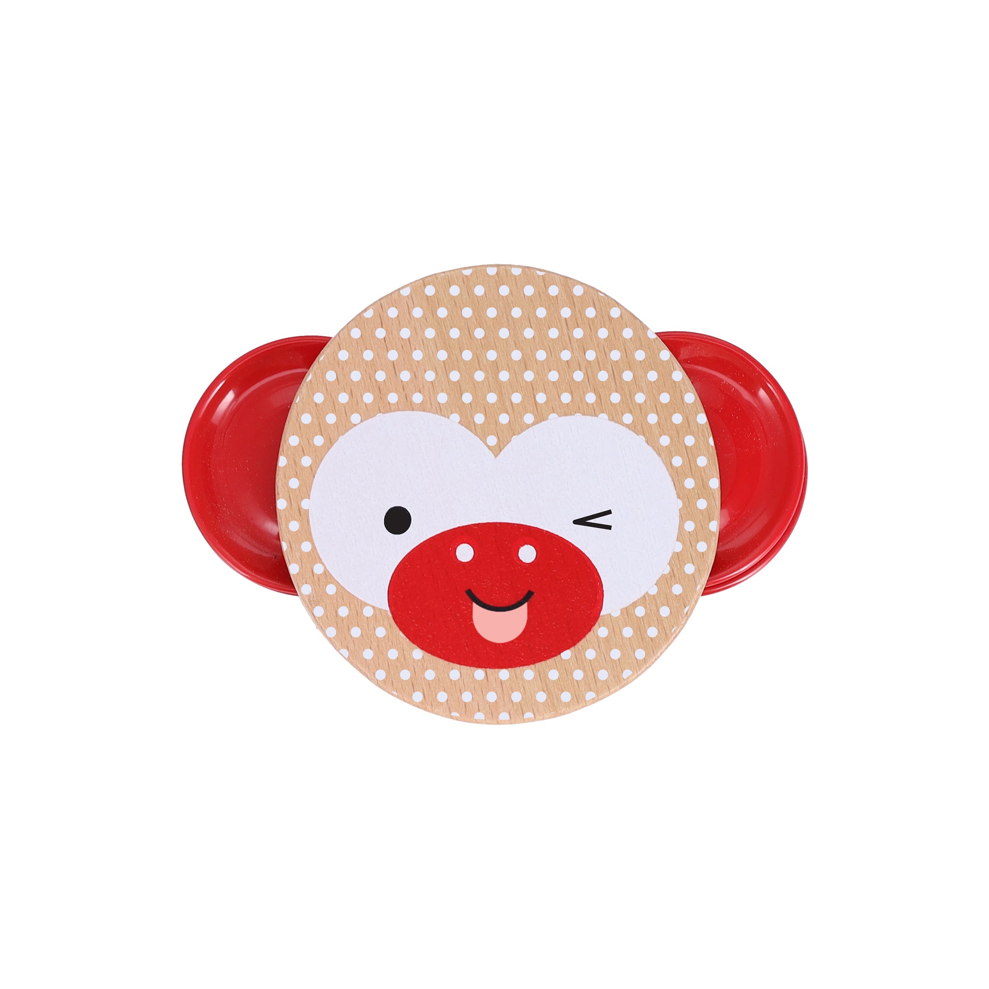 The Petit Collage Shake and Play: Wooden Tambourine is a round, polka-dotted instrument with red side handles, featuring a winking, smiling cartoon monkey face.