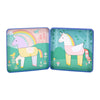 The Unicorns Magnetic Play Set by Petit Collage features two cartoon unicorns and rainbow scenes, letting kids create magical, whimsical backgrounds.