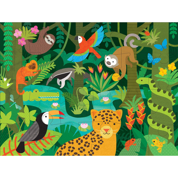 The Petit Collage Wild Rainforest 24-Piece Floor Puzzle features a vibrant jungle scene with animals like a jaguar, toucan, crocodile, monkeys, sloth, snake, frogs, parrots, and butterflies among lush green plants.