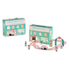 The Petit Collage Wind Up & Go Sweet Shop Play Set includes a pastel carry case, wooden figures, a candy van, and track—all with candy-themed decorations.