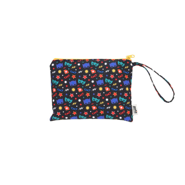 The Petit Collage Two Sided Superheroes On-the-Go Puzzle features a vibrant pattern of superhero masks, lightning bolts, and stars on a black background. This compact puzzle is perfect for fun wherever you go.
