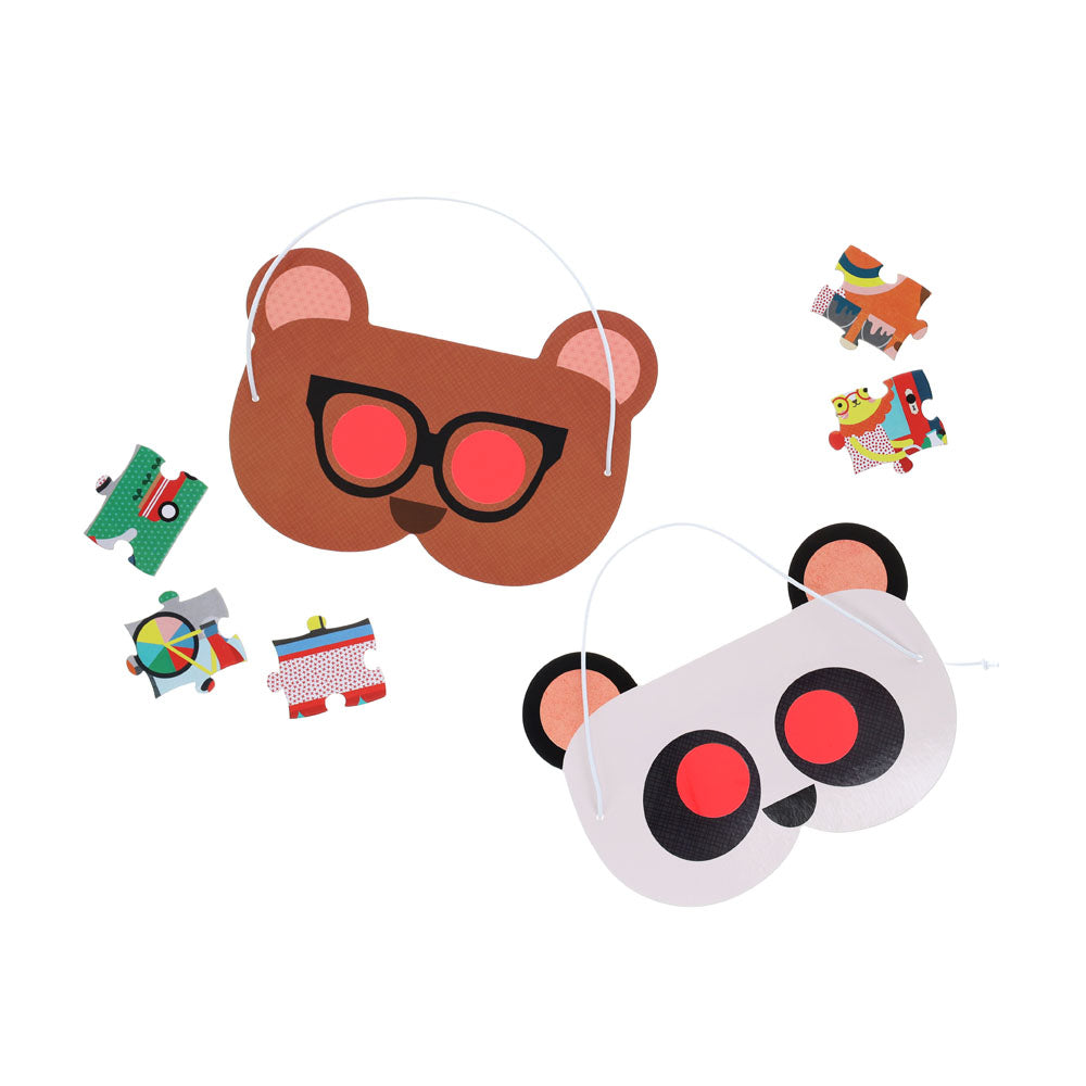 The Petit Collage Friendly Neighborhood 100-Piece Decoder Puzzle is shown on a white background with two animal face masks—a brown bear with glasses and a panda—plus several colorful puzzle pieces.