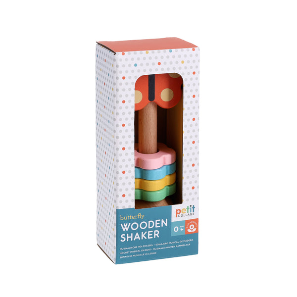 The Butterfly Wooden Shaker by Petit Collage is a pastel-colored, butterfly-shaped wooden shaker toy, packaged in a white polka-dot box.