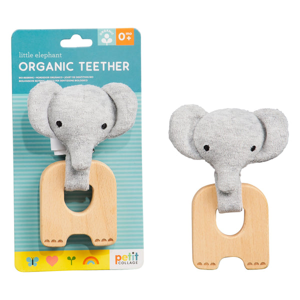 The Petit Collage Organic Elephant Teether is pictured in and out of its packaging. It features a gray, elephant-shaped organic teether with a plush head and wooden ring.