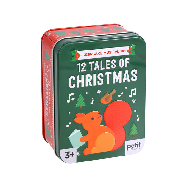 A green tin box by Petit Collage, labeled 12 Tales of Christmas, features festive decor with an orange squirrel, bird, trees, and musical notes. This keepsake musical tin is suitable for ages 3 and up.