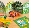 The Mosaic Sticker Activity: Animal Friends by Petit Collage includes a pop-up tiger, owl, forest backgrounds, an Animal Friends booklet, and bright geometric stickers to decorate the animals.