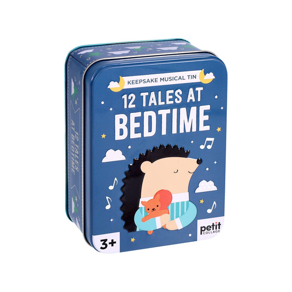 A blue tin box labeled "12 Tales at Bedtime" from Petit Collage features a hedgehog hugging a bear and is designed for ages 3+.