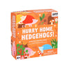 Square box for Petit Collage’s Hurry Home, Hedgehogs!: A Prickly Racing Game, with illustrated hedgehogs and plants on an orange background; suitable for ages 4+, includes choking hazard warning.