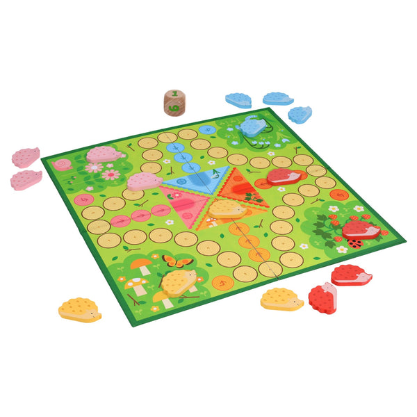 Hurry Home, Hedgehogs! by Petit Collage is a colorful board game featuring a green playing area, circular spaces, four sets of colored hedgehog tokens, and a wooden die for prickly racing fun.