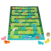 Slides and Climbs: A Get to the Top Game by Petit Collage features animal illustrations, four colored fish pieces, and a wooden die, all displayed on a white surface.