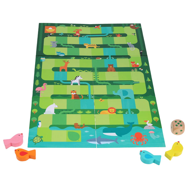 Slides and Climbs: A Get to the Top Game by Petit Collage features animal illustrations, four colored fish pieces, and a wooden die, all displayed on a white surface.
