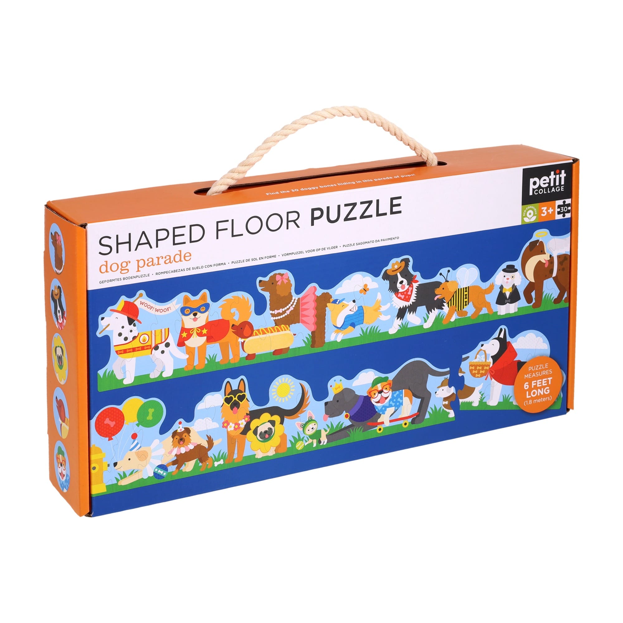 The Shaped Floor Puzzle: Dog Parade by Petit Collage comes in a rectangular box with illustrated dogs on the front and a rope handle on top.