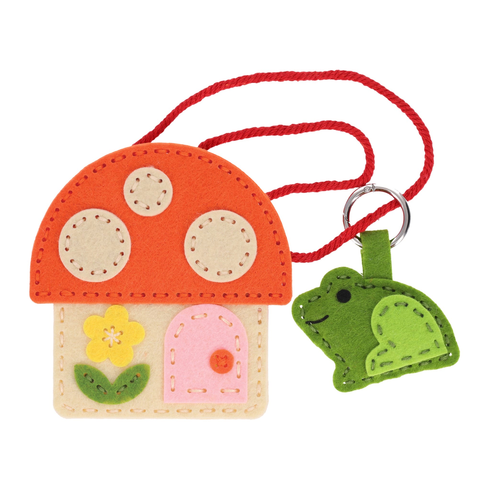 The Petit Collage Mini Craft Kit: Toadstool Purse features a felt mushroom house with a pink door, yellow flower, red cord, and includes a green felt frog keychain.
