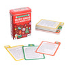 A tin labeled "Busy Ideas for Bored Kids: Christmas Edition" by Petit Collage sits beside a stack of colorful activity cards, with three cards displayed in front.