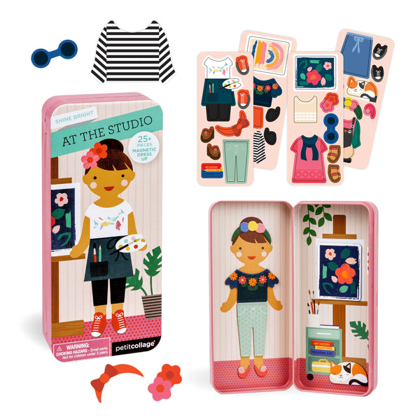 The Petit Collage At The Studio Shine Bright Magnetic Play Set includes a doll, clothing, and accessories, all in a storage tin with box packaging and multiple outfit options.