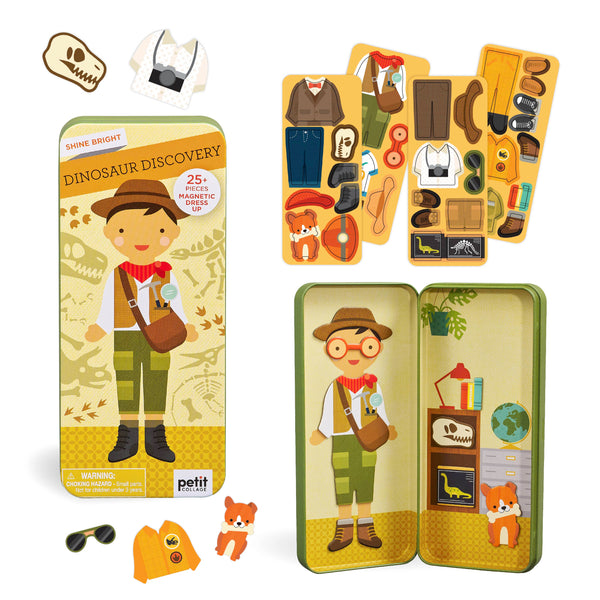 The Petit Collage Dinosaur Discovery Shine Bright Magnetic Play Set includes a metal case, explorer figure, animal magnets, clothing, and fun accessories like hats, glasses, and bags—all with a dinosaur explorer theme.