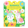 Cover of the Bunnies Coloring Book + Stickers by Petit Collage, featuring illustrated bunnies, flowers, and bright colors.