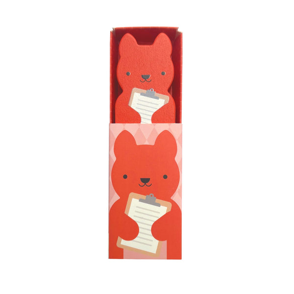 Sure! Here’s a rewrite using your product data: Sustainable Sam, the Wooden Planet Pal from Petit Collage, peeks out from a matching pink box with his friendly illustration on the front, holding a clipboard in his bear-shaped hands.