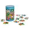 A cylindrical container labeled "Spot the Difference Puzzle: Fairy Tales" by Petit Collage stands upright, surrounded by several colorful puzzle pieces.